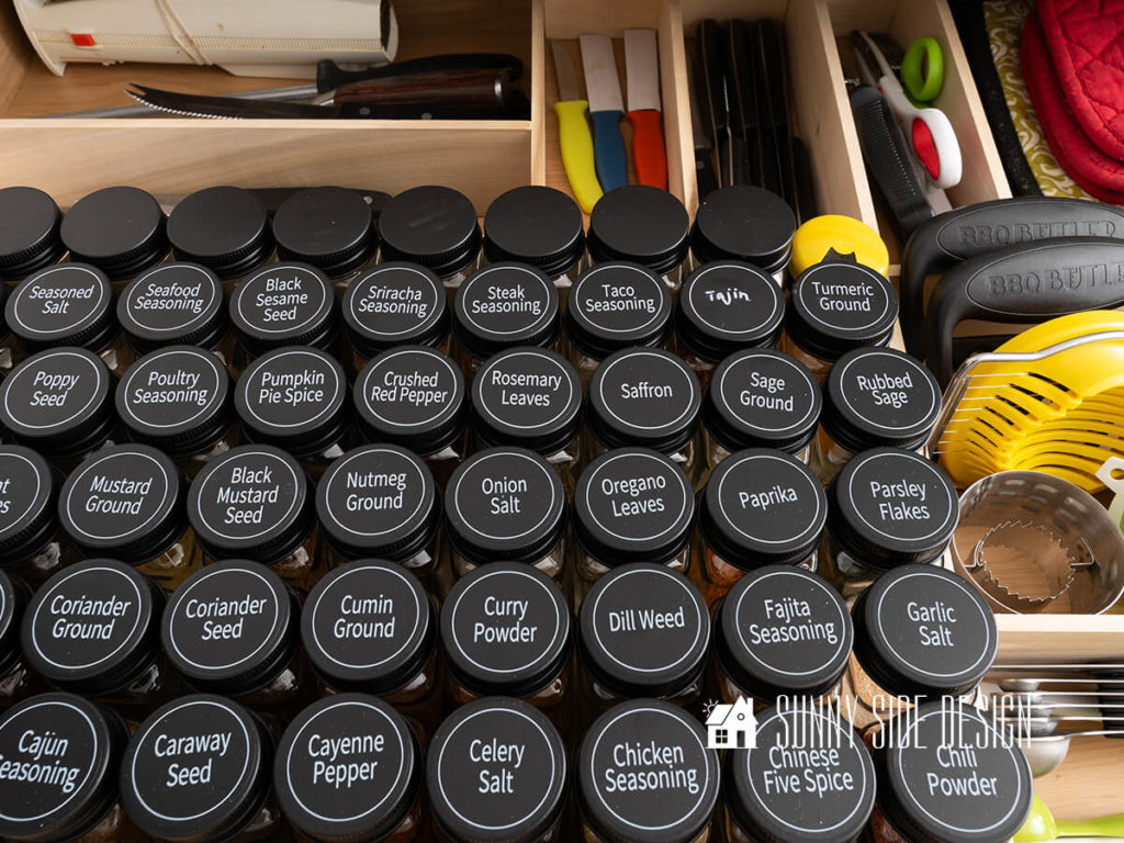 Custom wood DIY drawer dividers in kitchen spices, alphabetized.