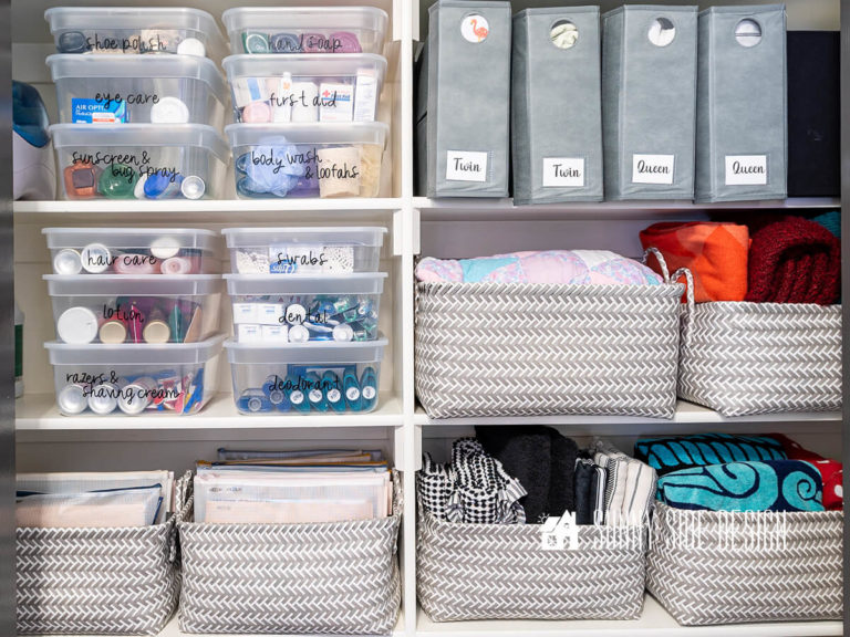Organize a linen closet with baskets and clear labeled lidded containers.