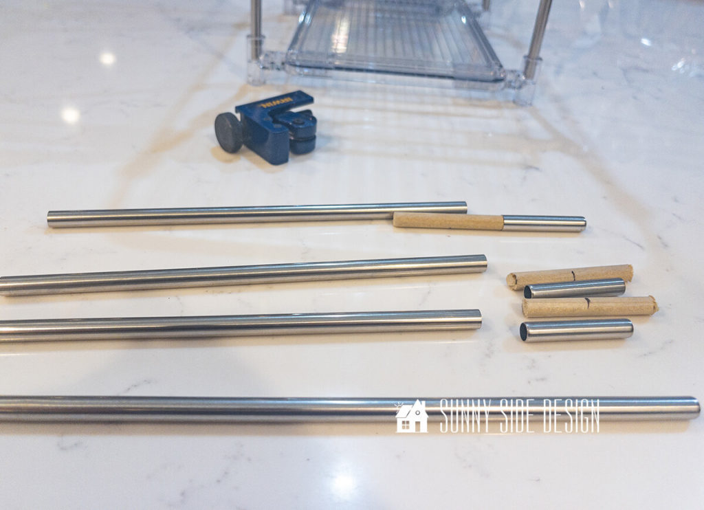 Rods are adjusted for the height needed for under kitchen sink storage with dowels.