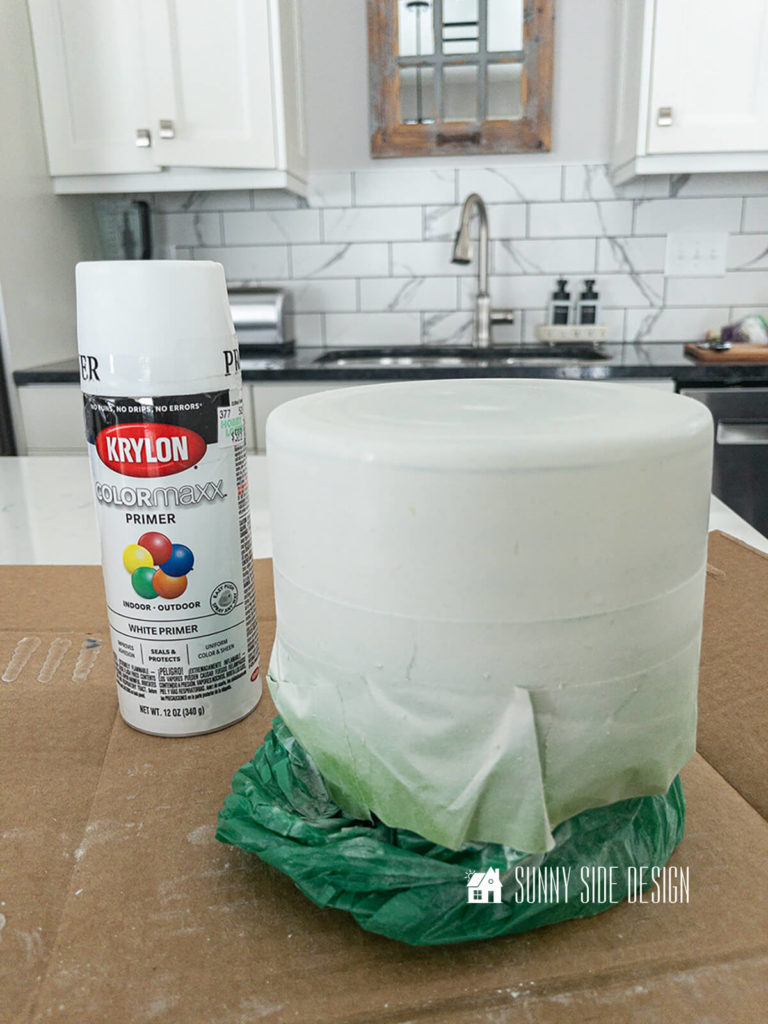 Goodwill thrifted vase with taped off design painted with primer.