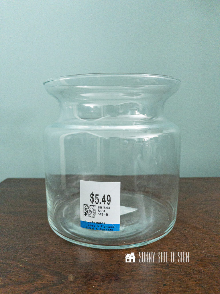 Goodwill vase before makeover with navy blue spray paint.