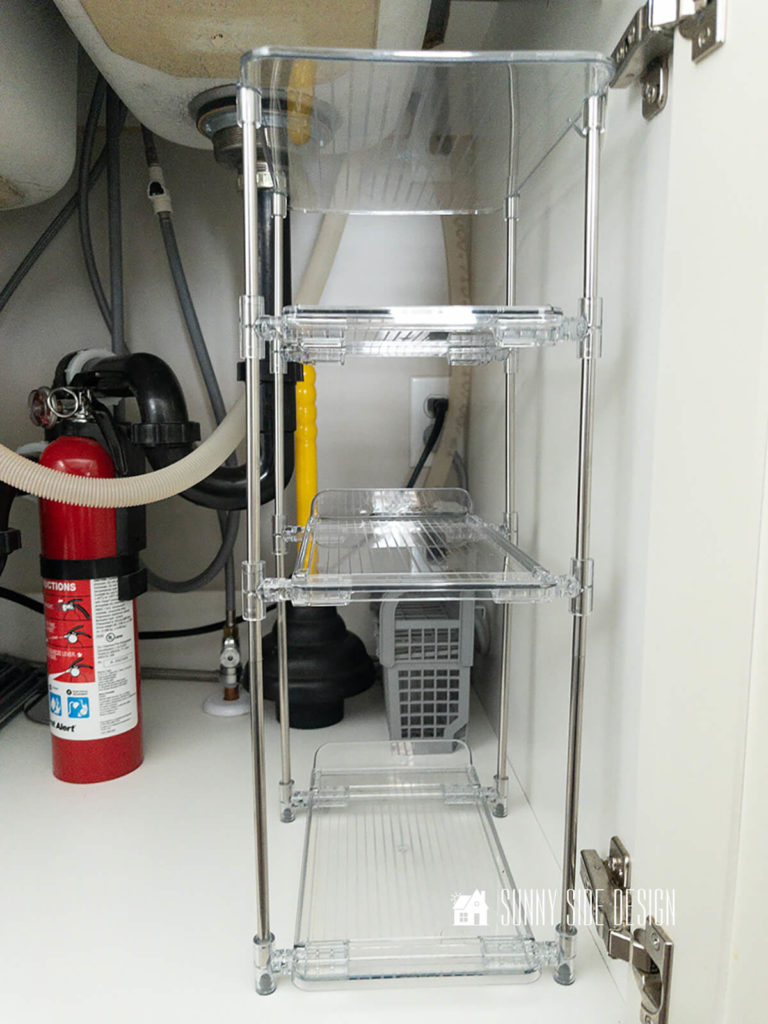 Under kitchen sink organizer with sliding drawers.
