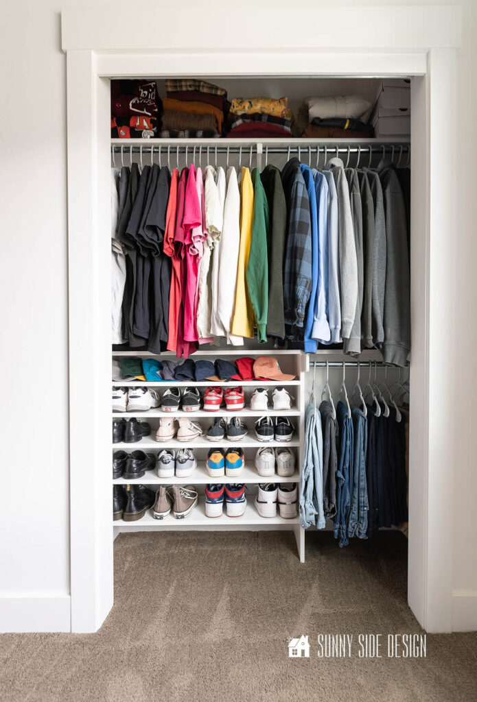 Final reveal of DIY closet organizer filled with shoes.