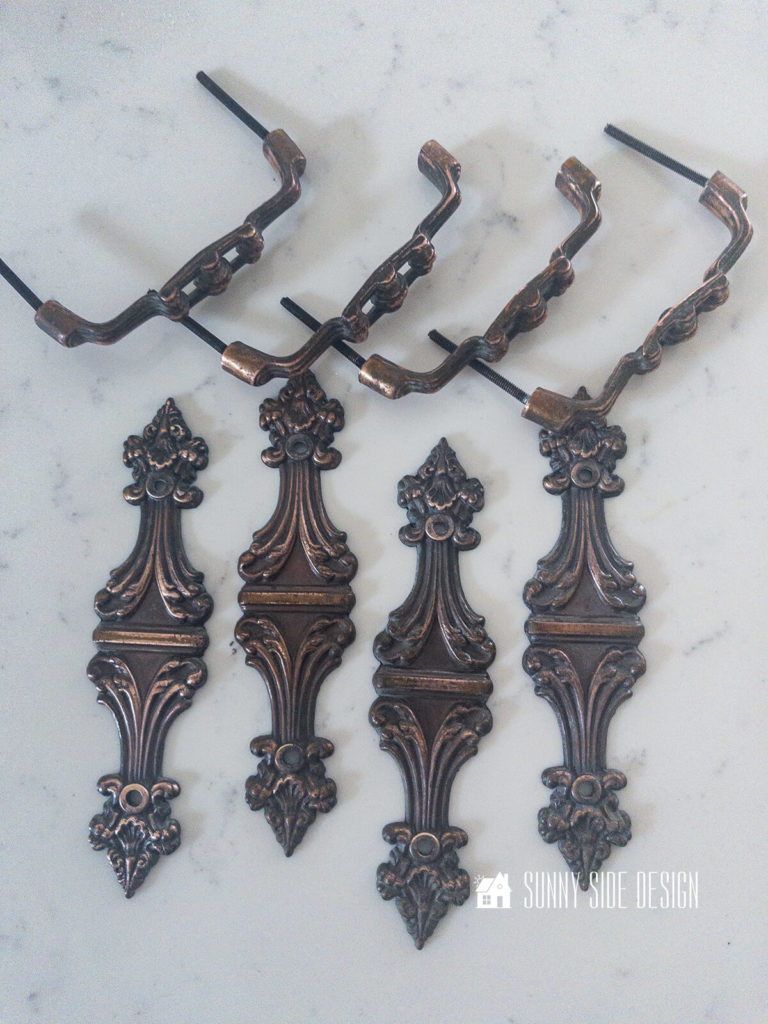 Hardware removed from the china cabinet top and cleaned with Bar Keepers Friend.