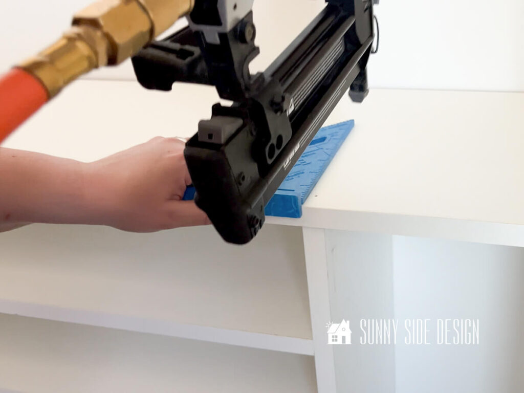 Secure top shelf to DIY closet organizer with brand nailer.