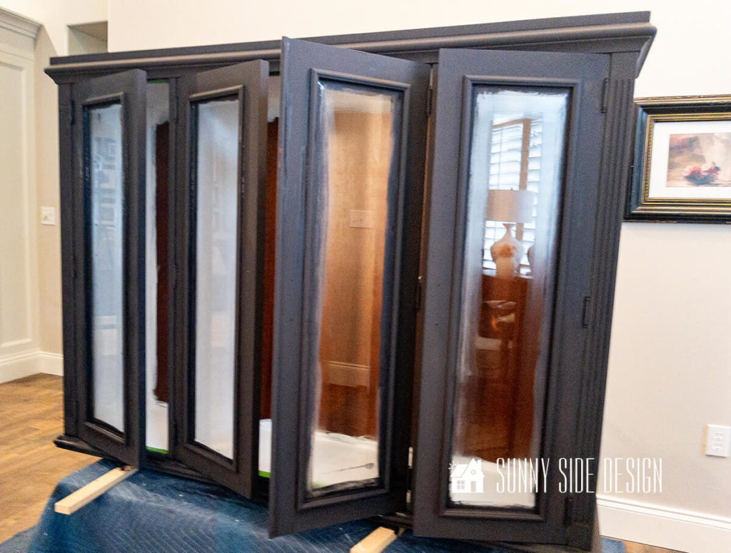 $5 thirfted hutch top is painted with black chalk paint on the outside and white chalk paint on the inside.