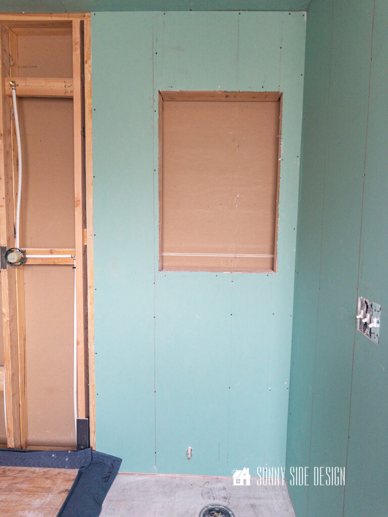 Recessed area created in wall for built in shelves.