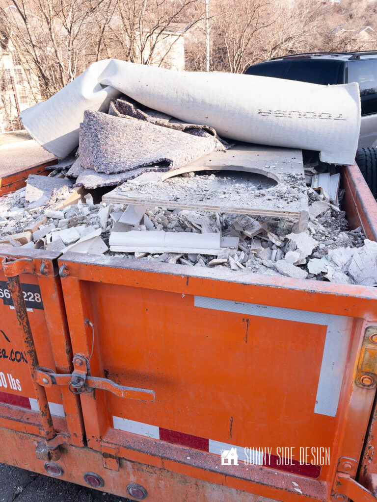 Bathroom rubble placed in a trailer after the demolition.