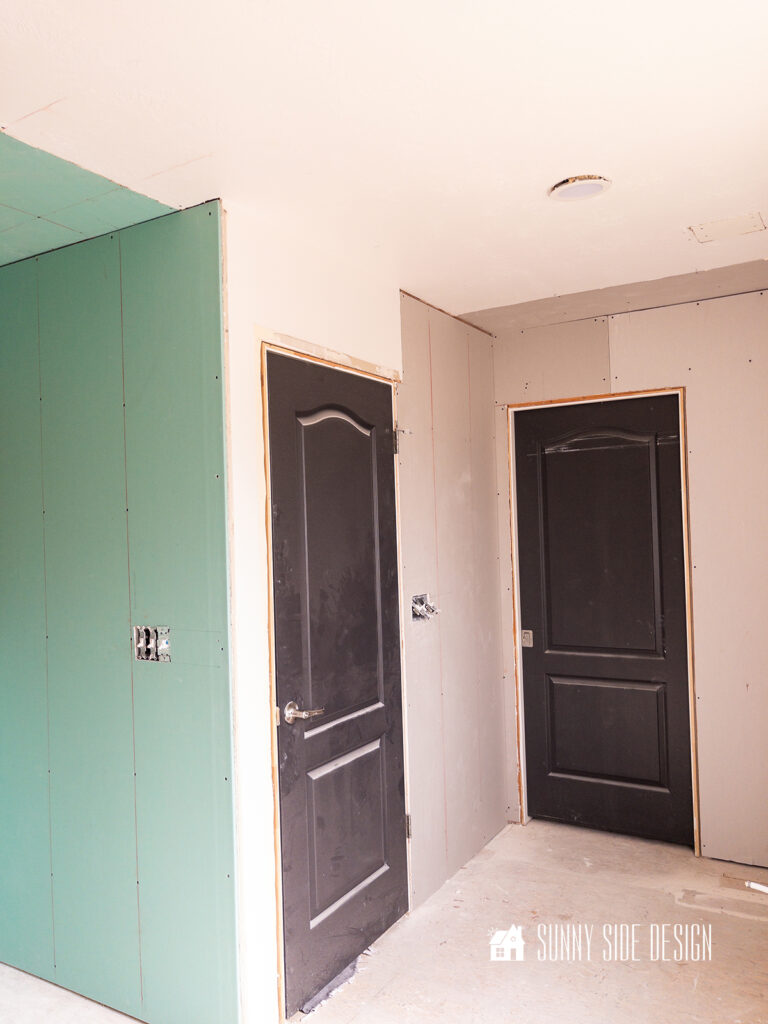 Bathroom progress, drywall is installed in areas that were removed or damaged during the bathroom demolition.