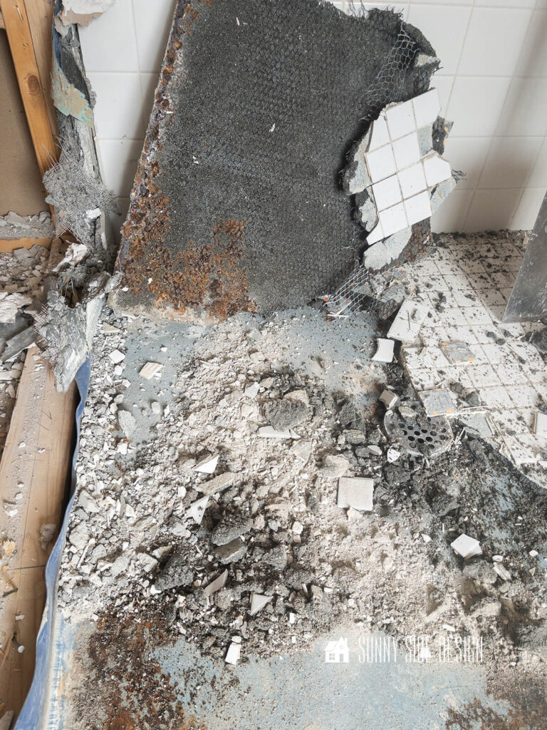 Old tile floor during demolition with the waterproof membrane protected the subfloor in the bathroom.