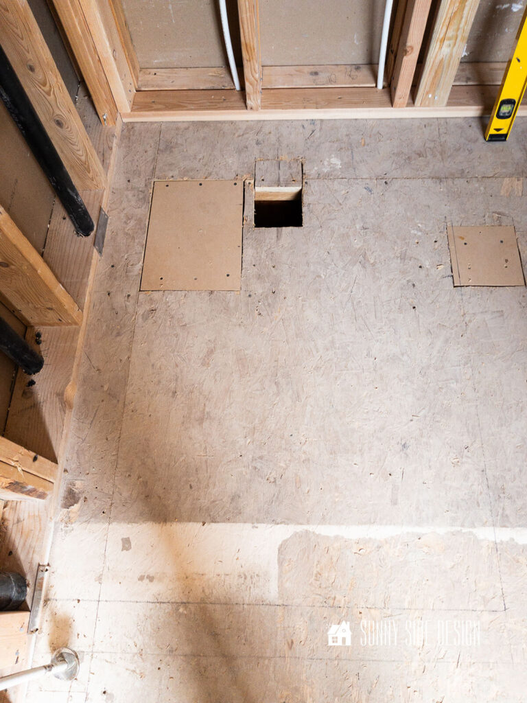 Bathroom subfloor is prepped with any damaged areas repaired before the shower pan is installed.