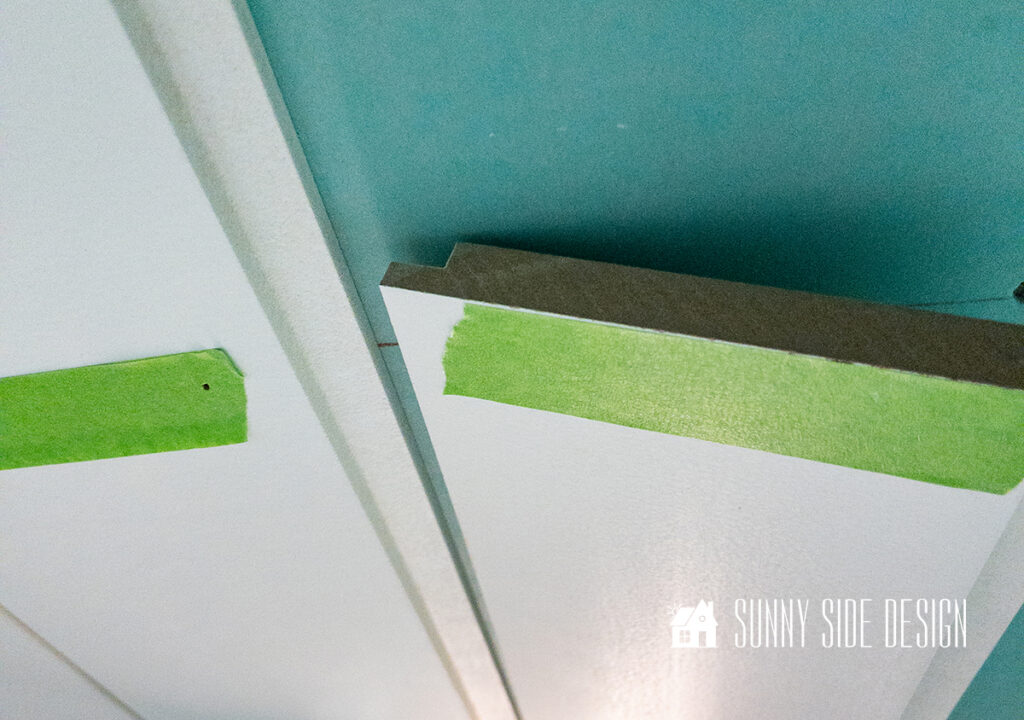 Shiplap is installed on the bathroom ceiling.