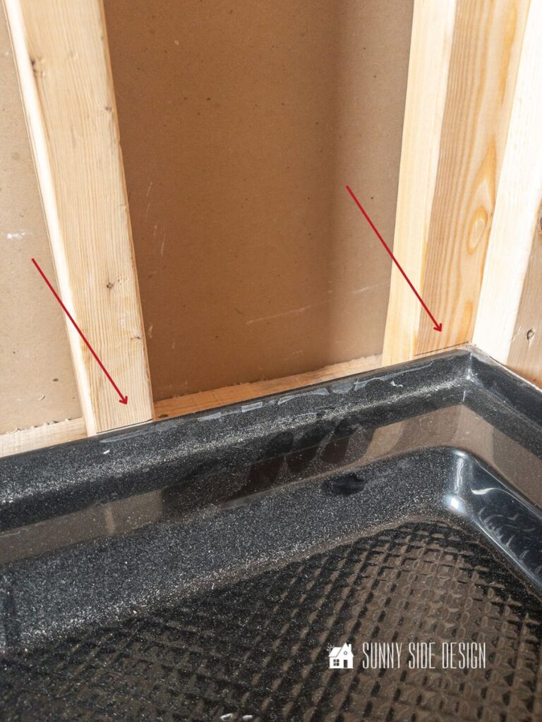 Pencil lines are placed on the studs for the proper alignment when ready to install a shower pan.