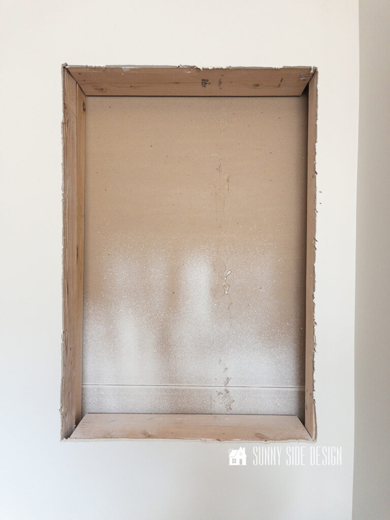 Cut out in drywall for the recessed shelves.