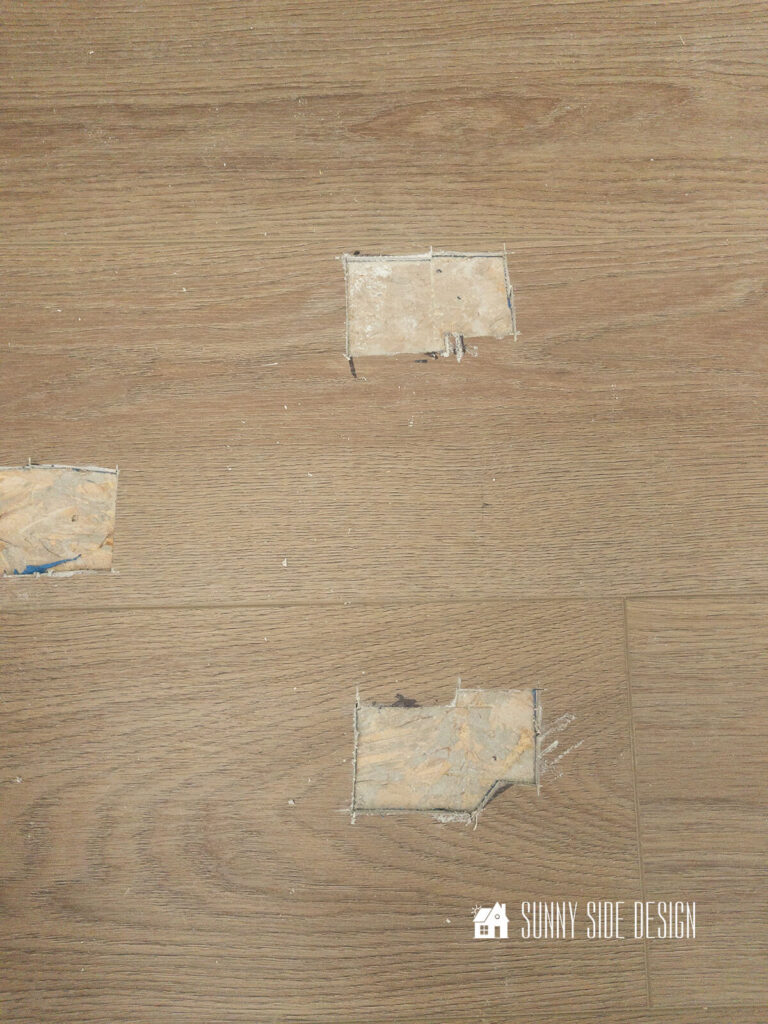 Small sections of the vinyl planks are cut out to allow for the free-standing tub legs, This will allow for the vinyl plank floor to float.