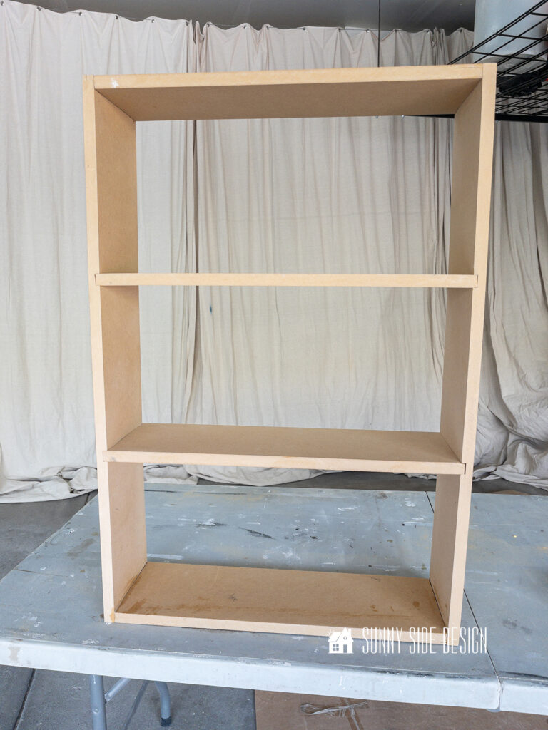 Build recessed shelf before backing is attached.