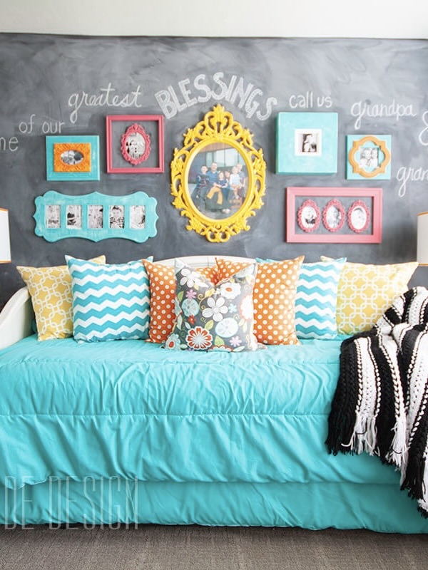 Finished sleepover room with chalkboard room and colorful frames