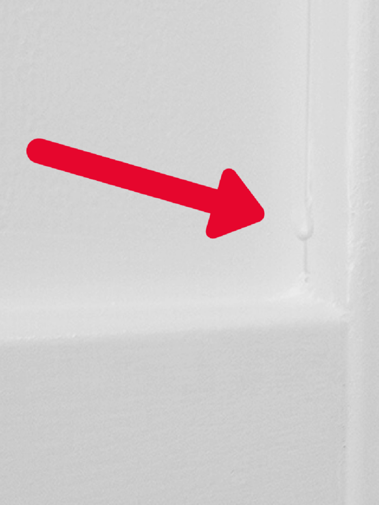 arrow showing dried paint drip
