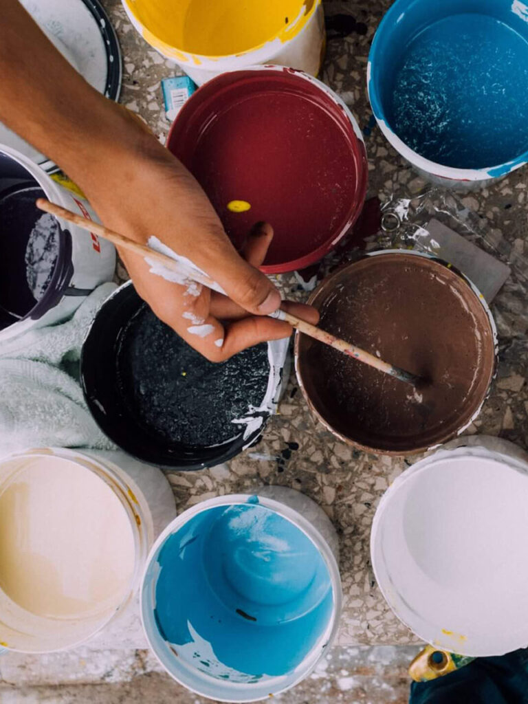 multiple containers of different paint colors