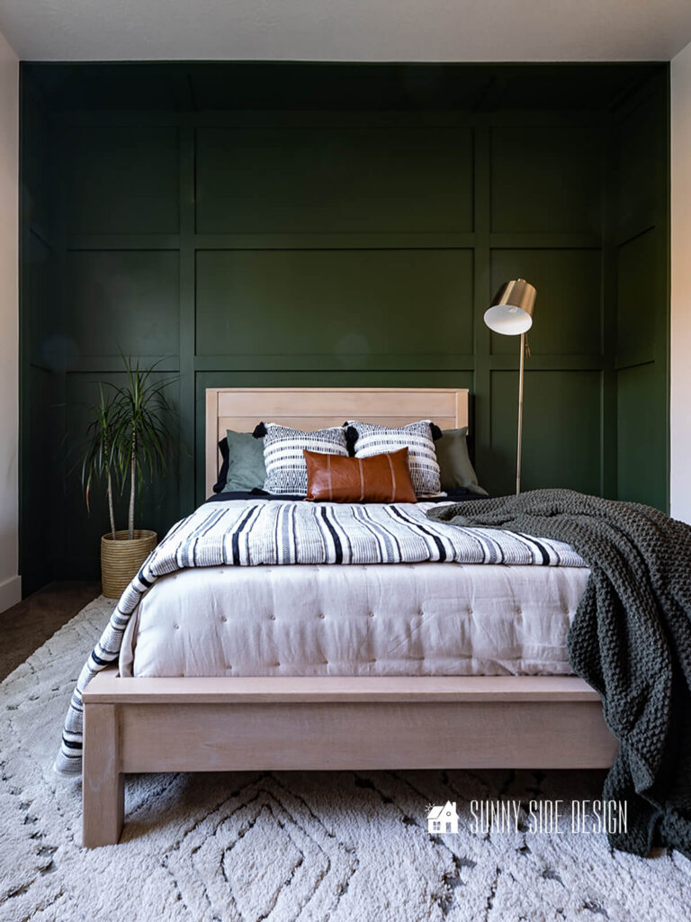A dated old wood bed found on the classifieds is modernized and giving a faux rifted oak finish.