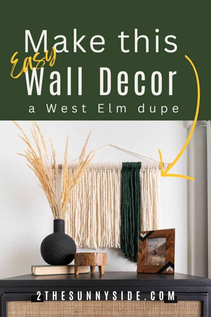 Easy DIY Fiber Wall Art pin image. Cream and green roving hung from a dowel, hung above a black and cane dresser.