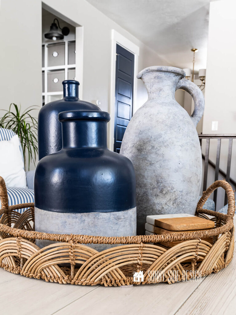 Dated thrift store vases updated with navy blue spray paint and layered white, grey and brown paint.