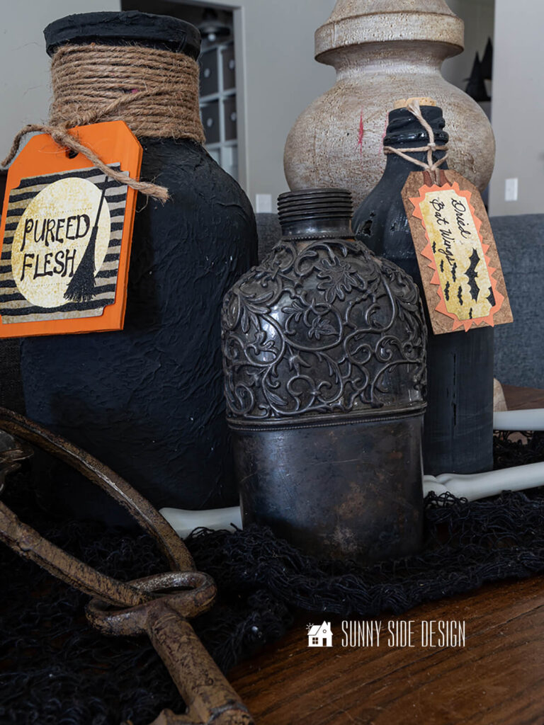 A grouping of black potion bottles.