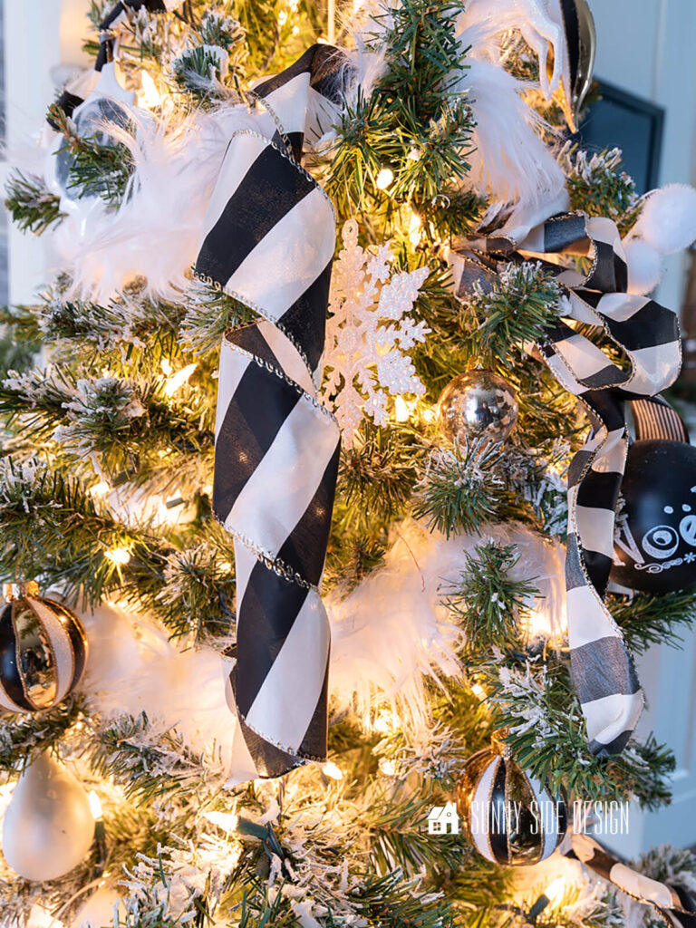 Coiled black ivory wired satin ribbon on a Christmas tree.