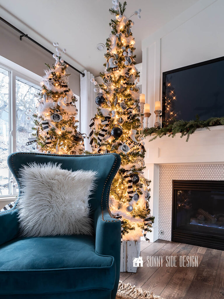Decorating with black and ivory wired Christmas ribbon on a Christmas tree.
