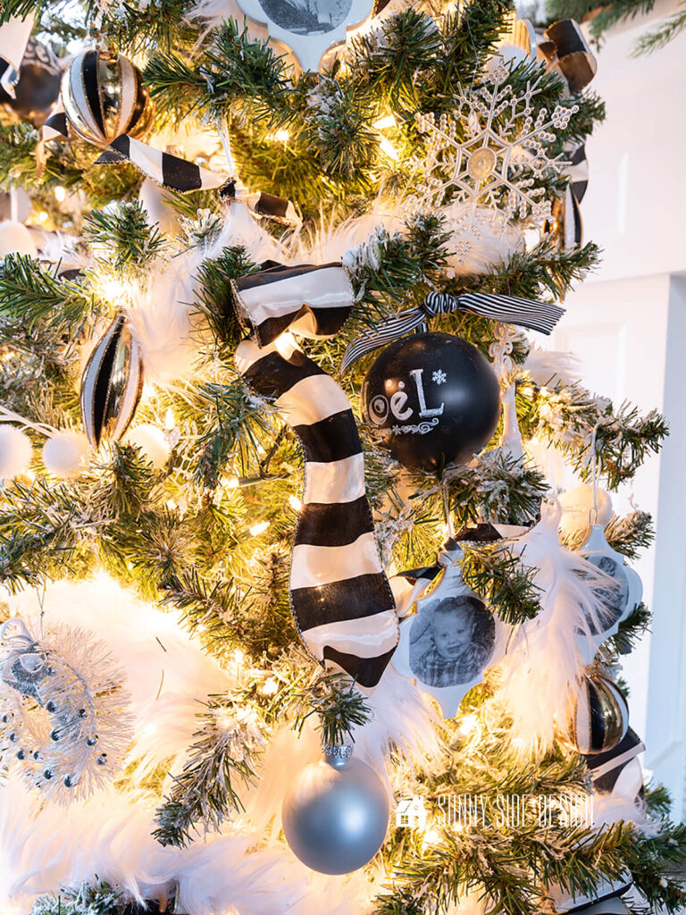 Double looped ribbon is placed into a flocked Christmas tree.