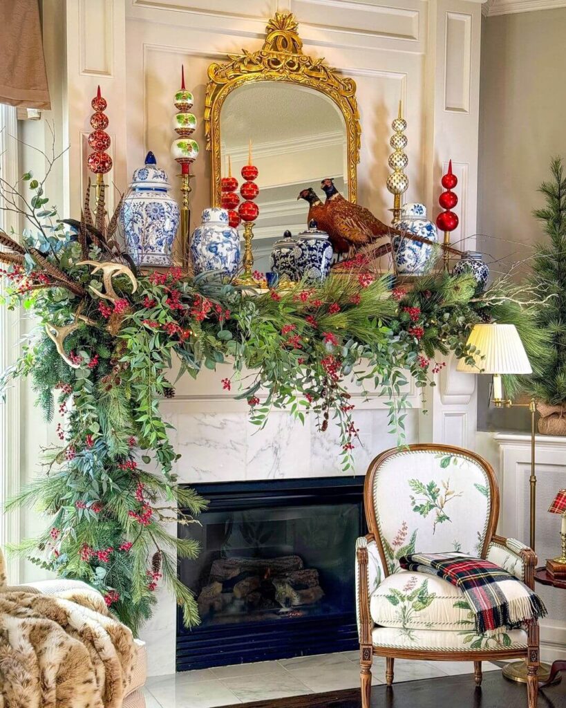 Stunning Scottish inspired mantle with a variety of greens draping over the edge of the mantle. Embellished with berry stems, antlers, pheasants and tree toppers.