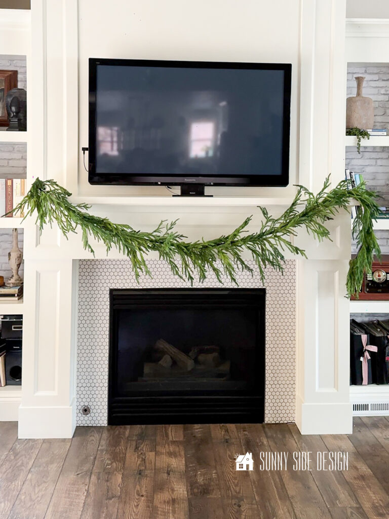 Single Faux garland hung on mantle.
