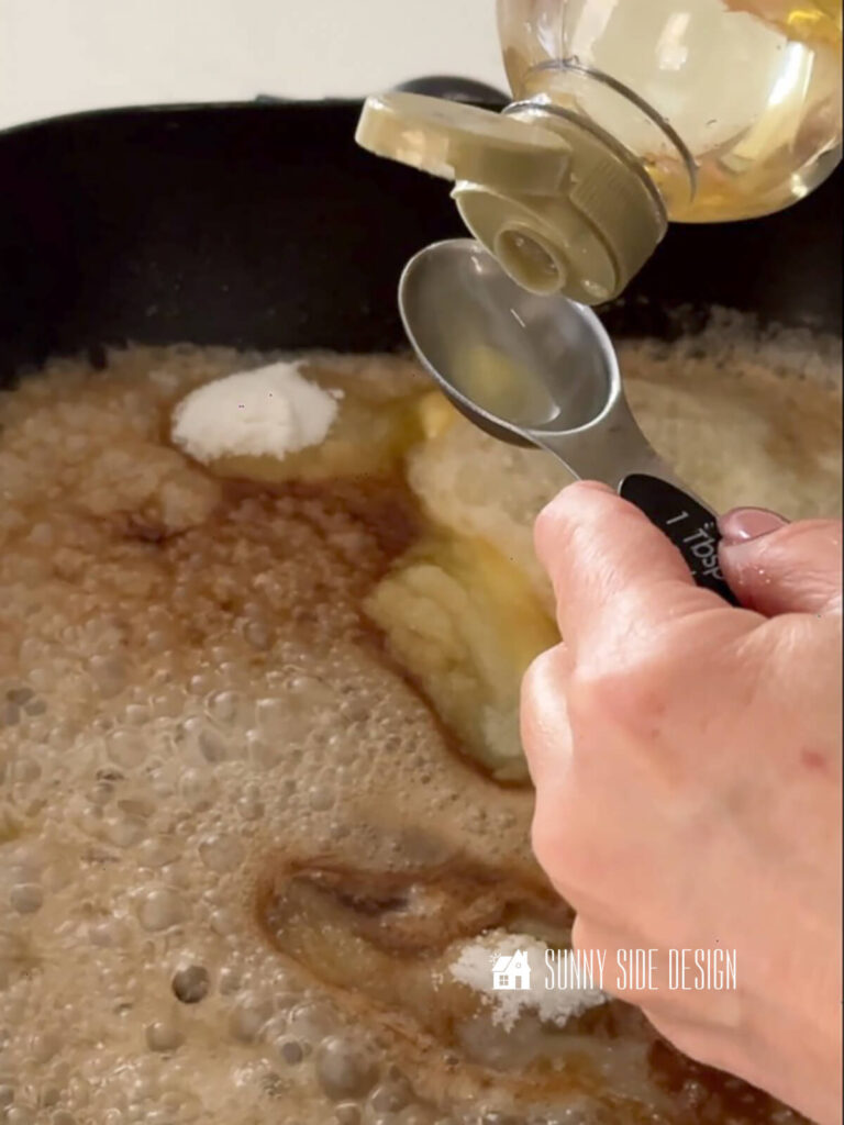 Woman adds corn syrup to the toffee.