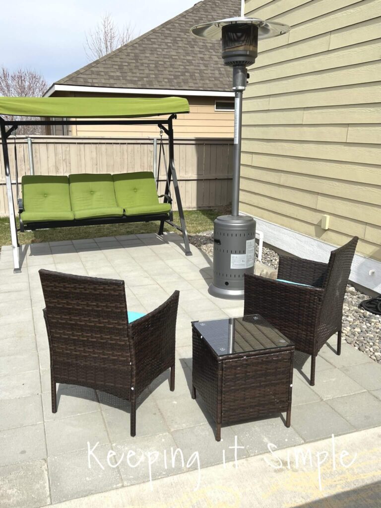 Simple paver patio ideas. 12x12 pavers in a modern linear pattern, styled with an outdoor seating area.