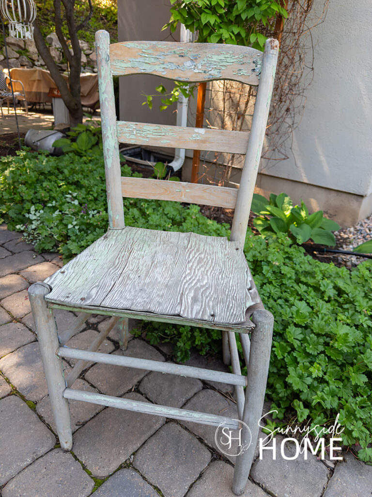 Vintage ladderback chair before the makeover in the garden.