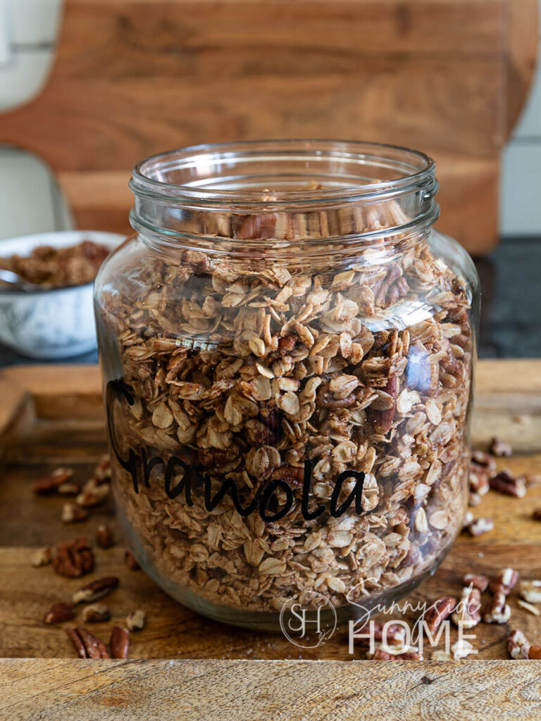 Homemade granola in a labeled glass jar.