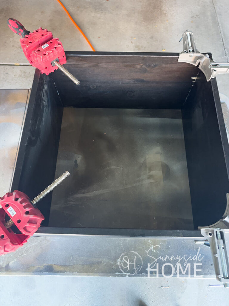 Four clamps are used to hold the box together.