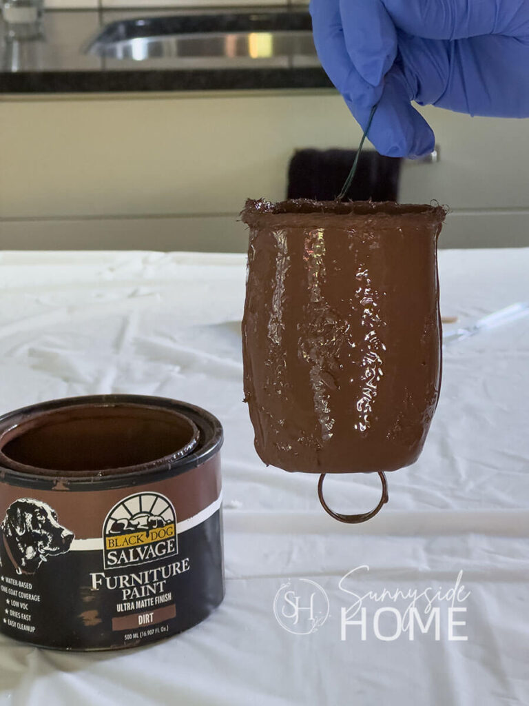 Recycled container painted brown.