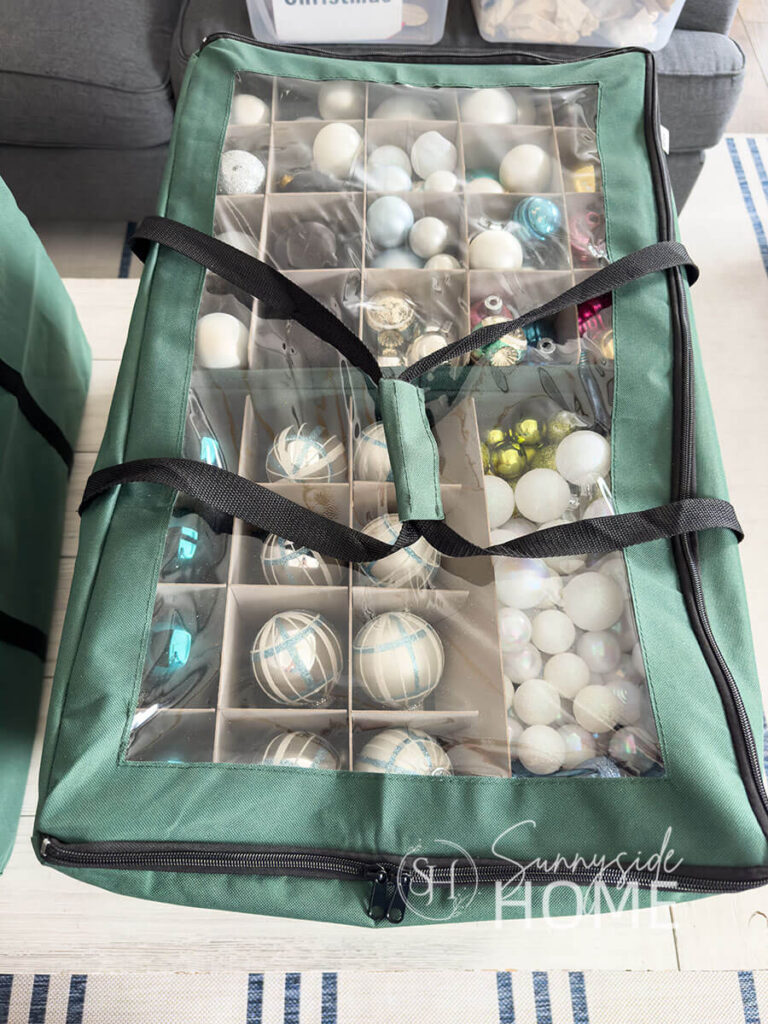 A large canvas tote sorts and keeps Christmas ornaments organized.