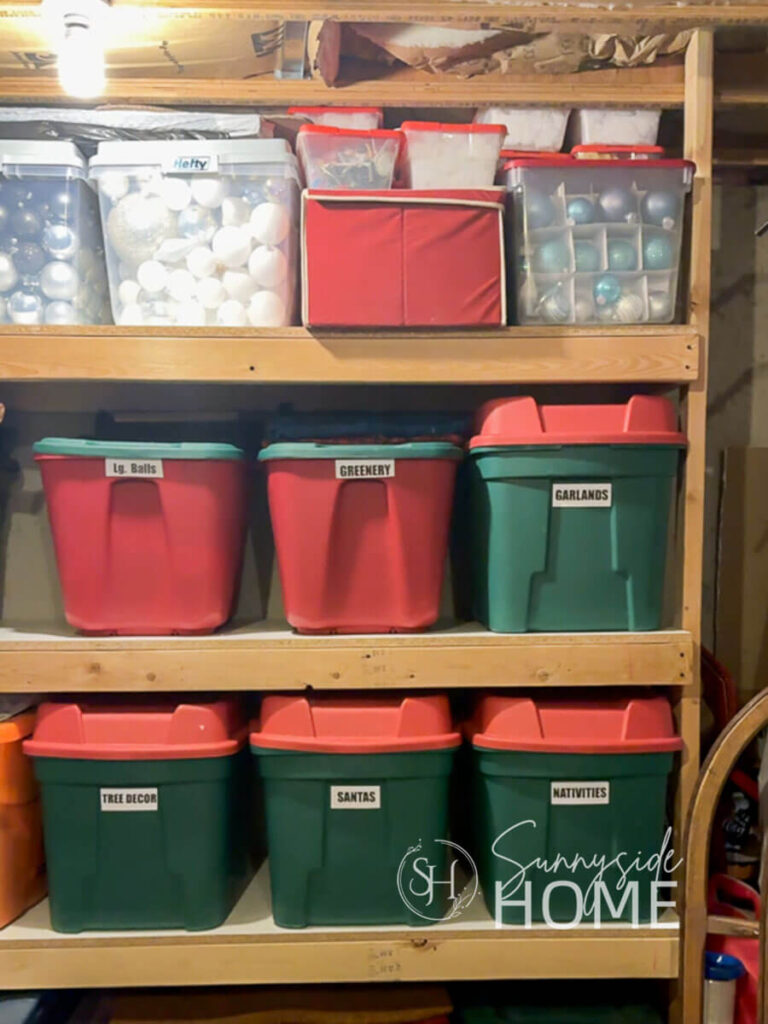 Store and organize Christmas decorations in labeled bins in a basement storage room.