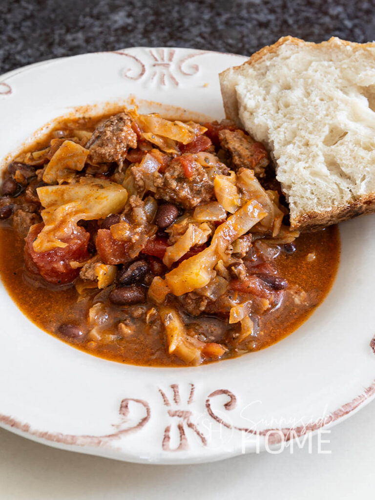 Easy beef and cabbage soup served with a slice of sour dough bread