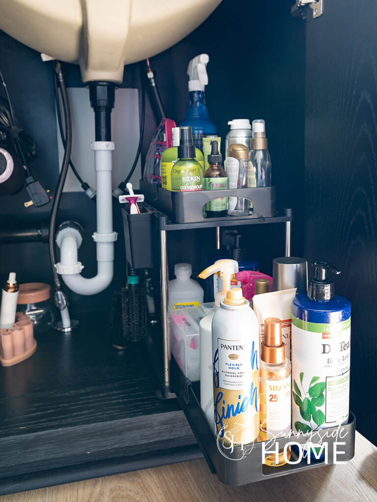 Keep bathroom counter clear with simple organization. Tiered sliding trays keep bathroom products easily accessible and keep the bathroom looking neat and tidy.