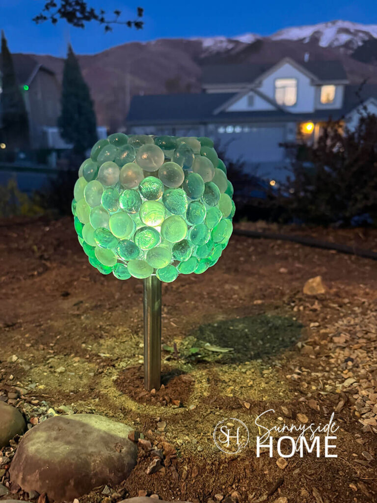 Dollar store solar lights gets a glow-up with a glass gem orb shade.