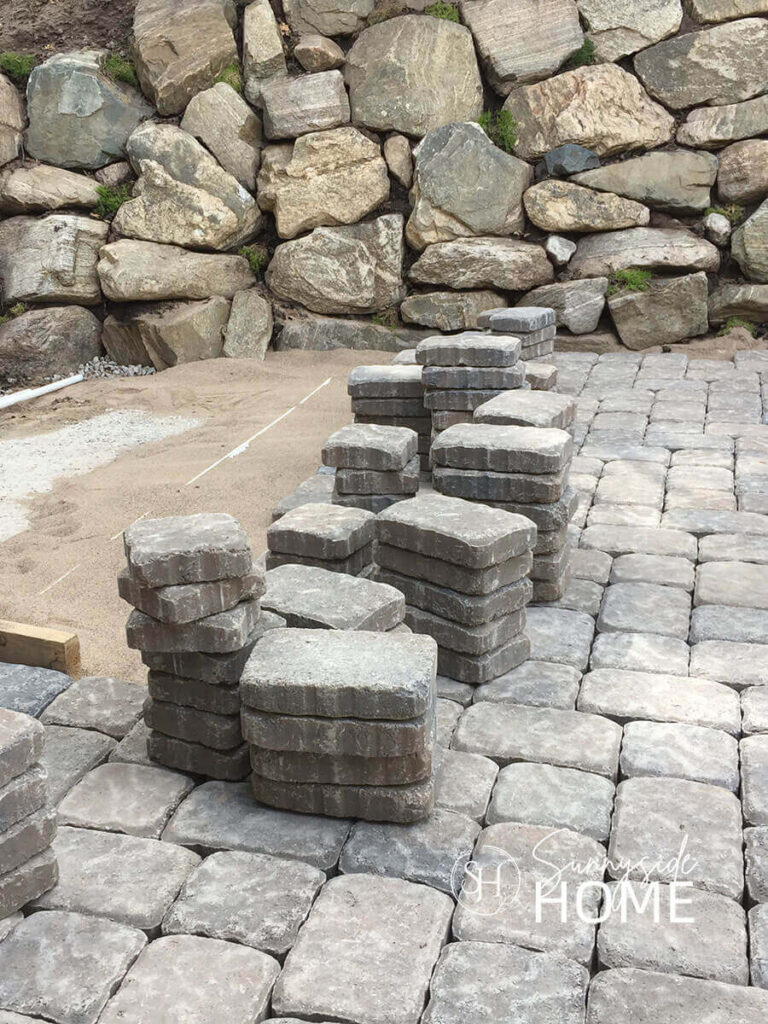 Backyard ideas: installation of a paver patio in progress.