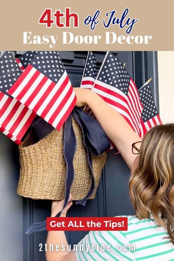 Pinterest image Easy 4th of July Door Decor, Woman places thrift store basket filled with flags and embellished with ribbon on a navy blue front door.
