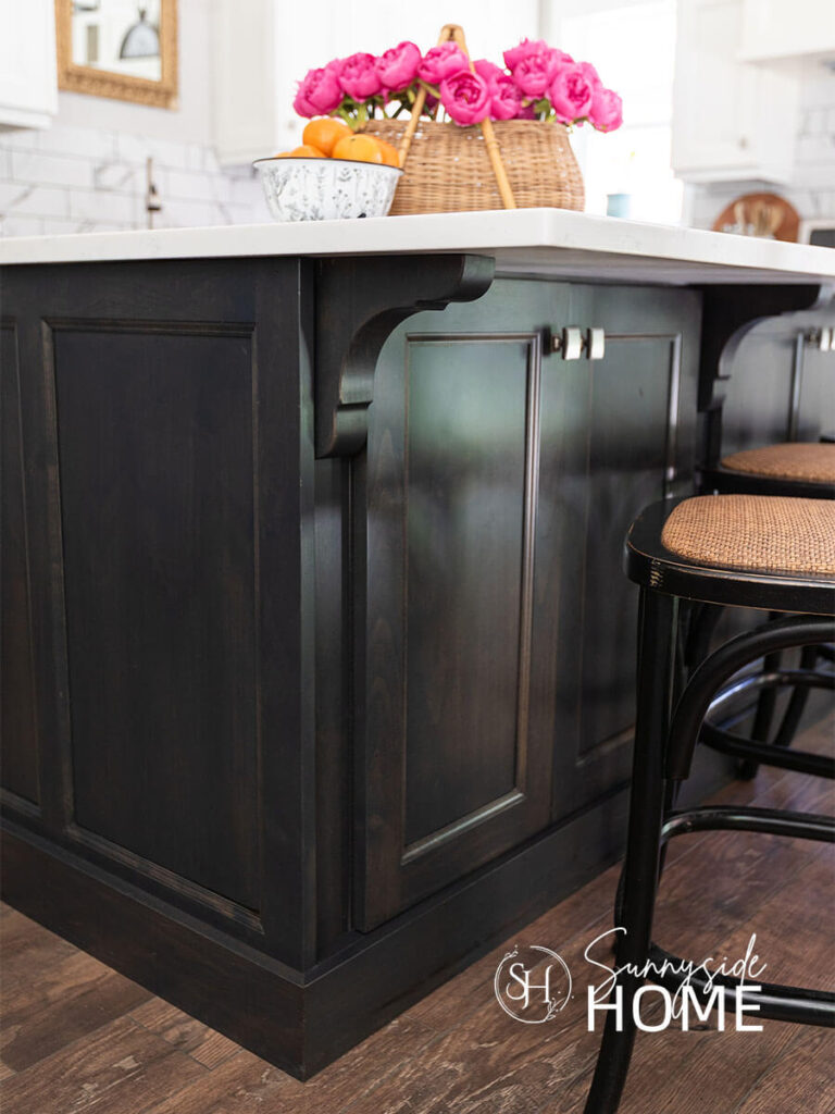 Dark stained kitchen island after fix chipped kitchen cabinets with a stain pen.