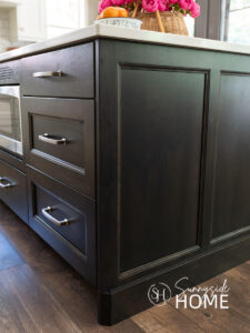 Dark stained kitchen island after fix chipped kitchen cabinets with a stain pen.