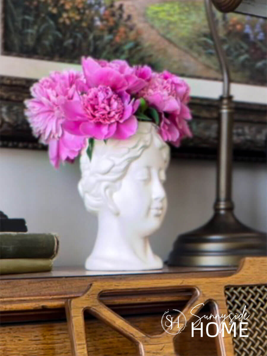 Head vase before adding the old world texture finish. Styled on the piano with fresh pink peonies.