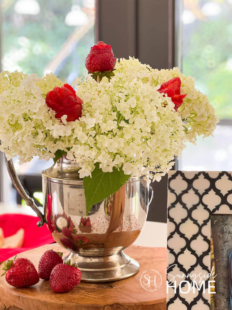White hydrangea and strawberry centerpiece for a berry in love bridal shower ideas.