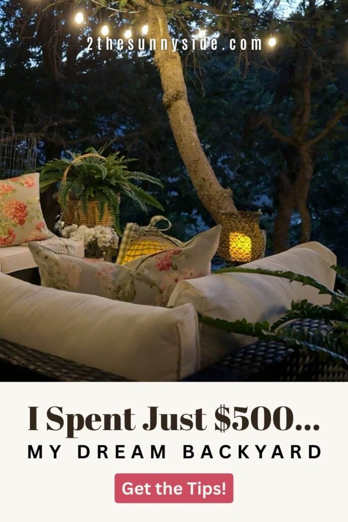 Pinterest image: outdoor living room at dusk with string lights and candles glowing around lounge area with text that reads: I Spent Just $500 - my dream backyard, get the tips.